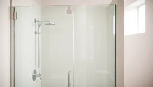 Showcasing a stylish frameless glass shower enclosure with clear panels and minimal hardware in a modern bathroom.